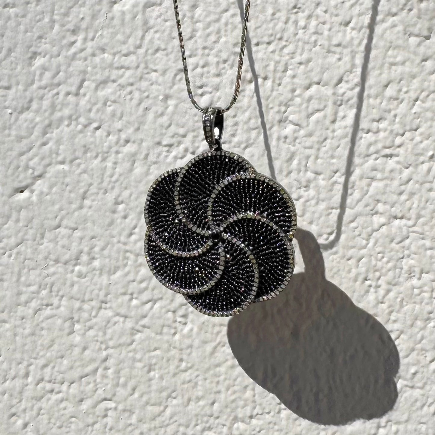 Black Spinel and Diamonds Rhodium Plated Sterling Silver Floral Pendant