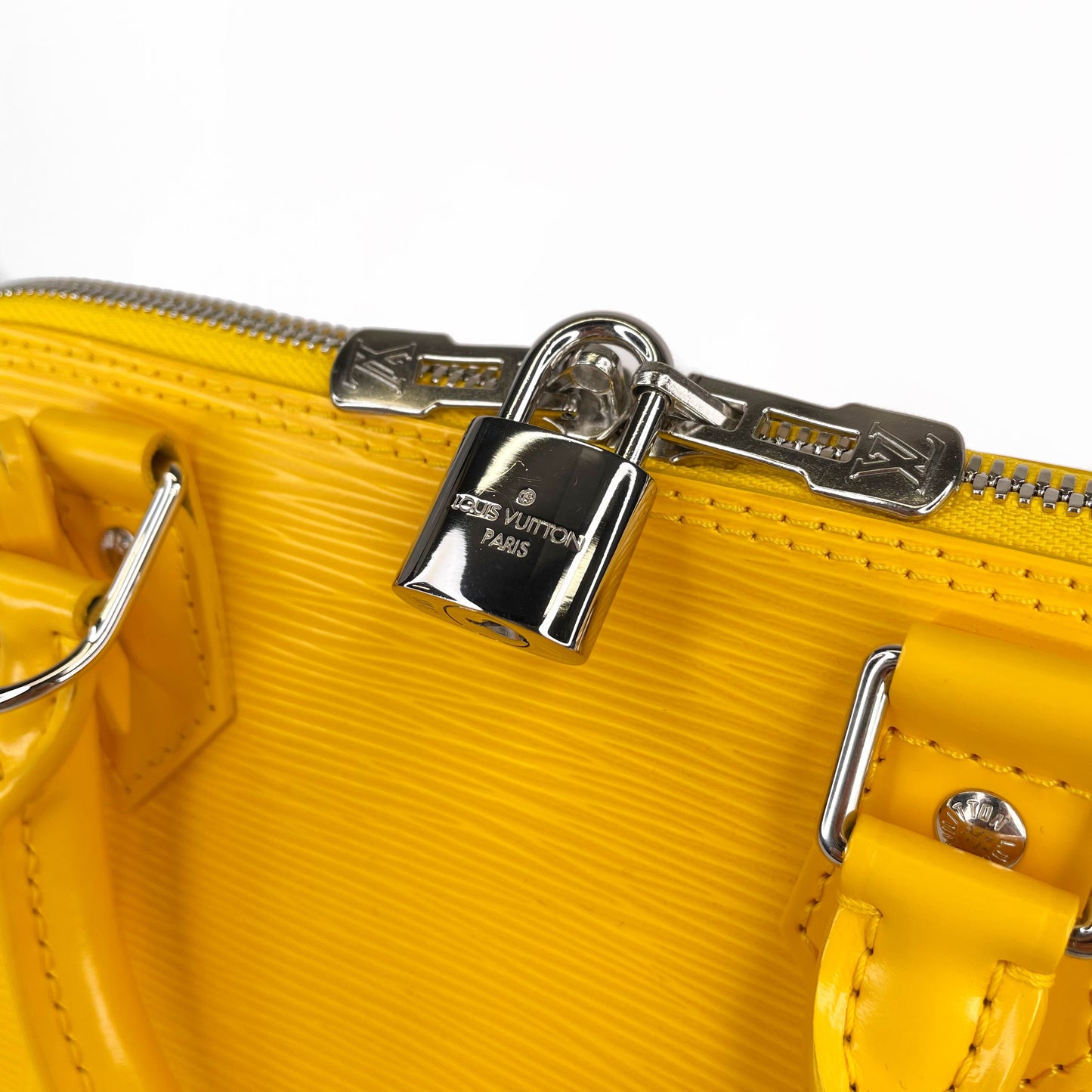 LOUIS VUITTON Yellow Alma PM Satchel