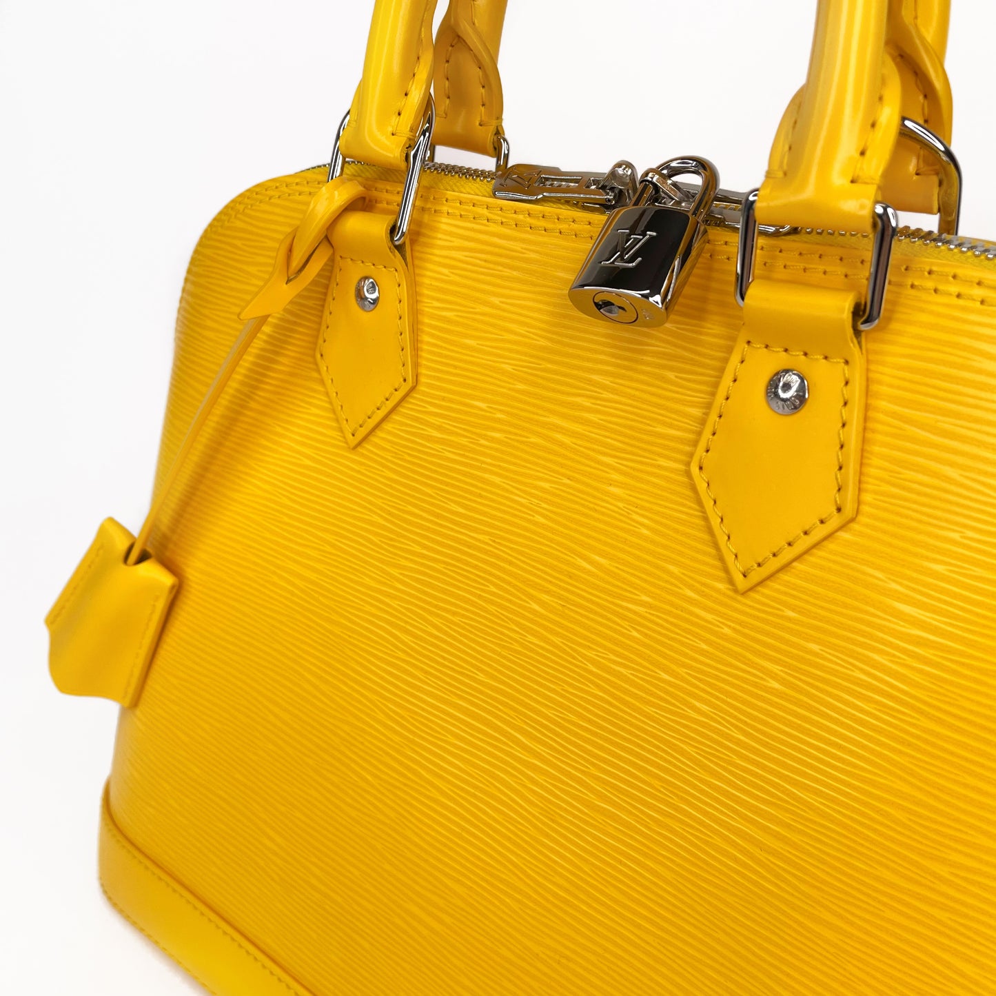 LOUIS VUITTON Yellow Alma PM Satchel