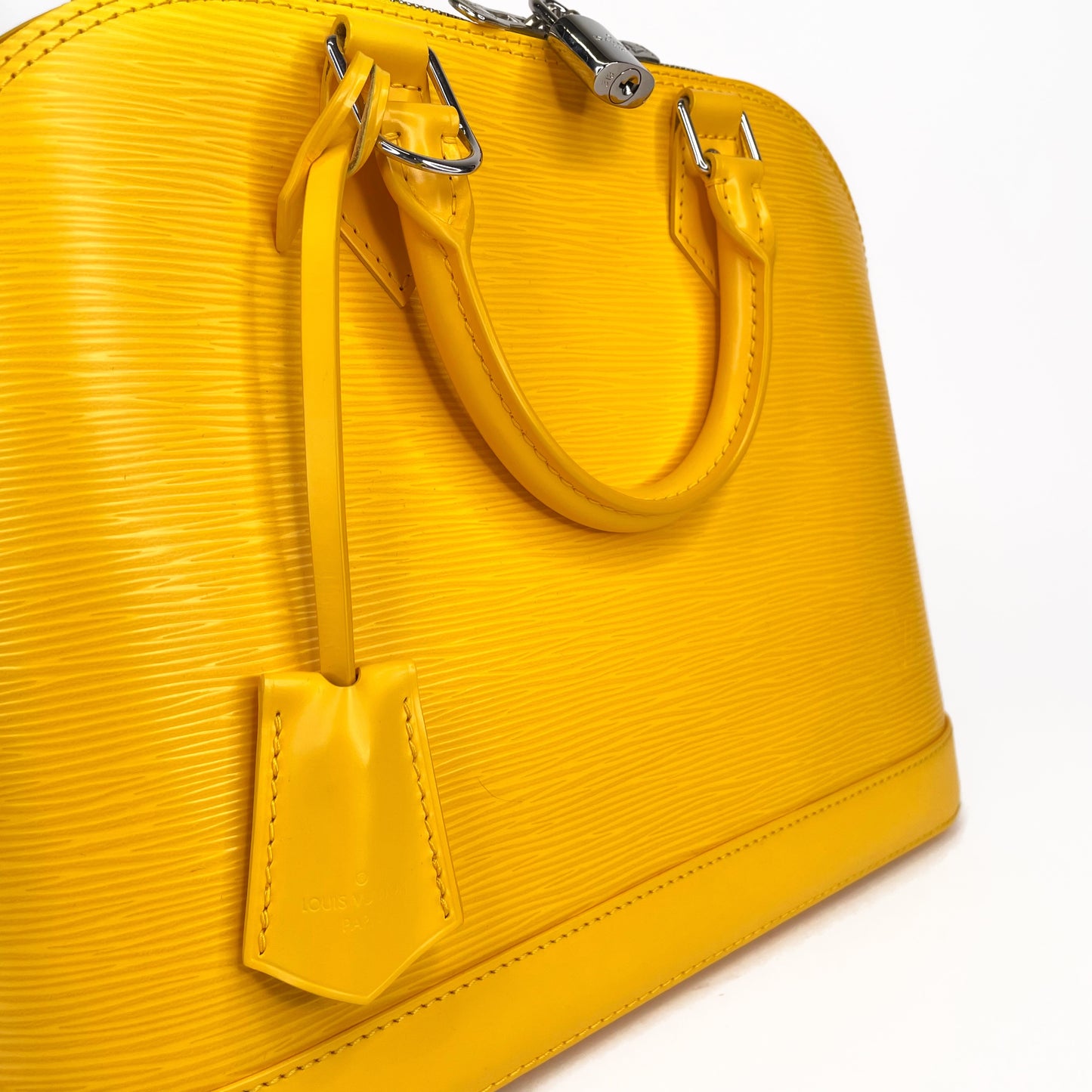 LOUIS VUITTON Yellow Alma PM Satchel